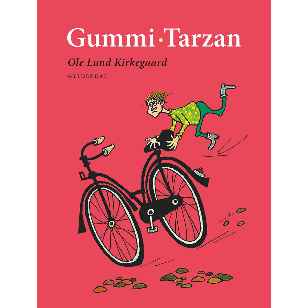 Et rødt cover med en tegning af en mand på cykel