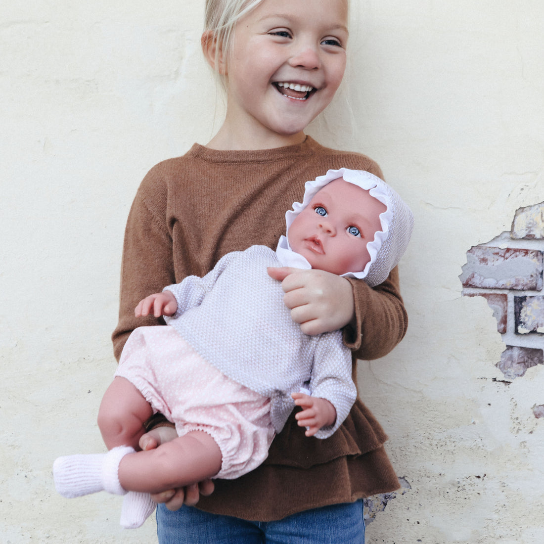 Así Leonora baby doll, 46 cm – Pink romper and beige blouse