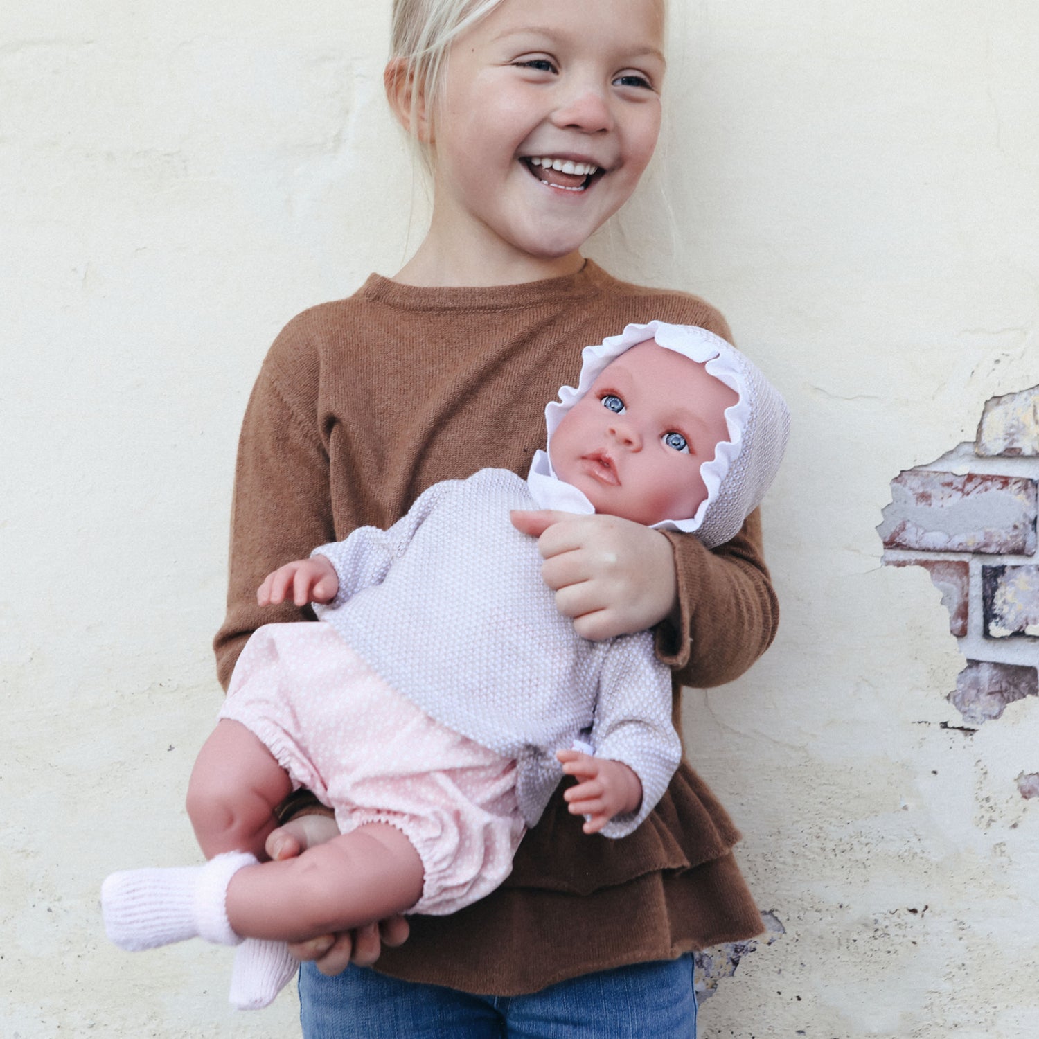 Así Leonora baby doll, 46 cm – Pink romper and beige blouse